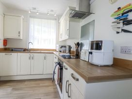 A kitchen with a sink and appliances at Sea Ledge in Tintagel