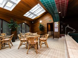 A pool room with tables and chairs at Timberwick Green Akeld near Wooler