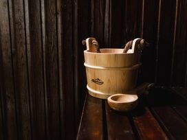 A wooden bucket and scoop on a wooden surface at Timberwick Green near Wooler