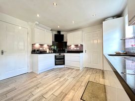A kitchen with cabinets and appliances at Harefield in Rothbury