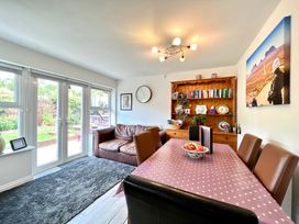 A dining room with a table and chairs at Harefield in Rothbury