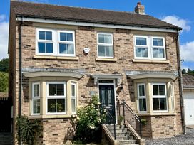 A house with windows and a door at Harefield in Rothbury