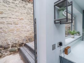 A kitchen with stairs leading outside at 3 Lisburn Street Alnwick