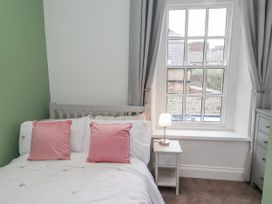 A bedroom with a bed and window at 3 Lisburn Street Alnwick