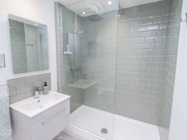A bathroom with a shower and sink at 3 Lisburn Street Alnwick