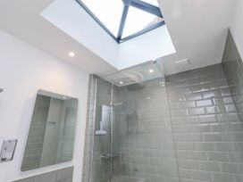 A bathroom with a shower enclosure and skylight at 3 Lisburn Street Alnwick