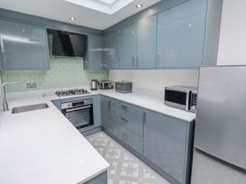 A kitchen with modern appliances at Middle Cottage in Alnwick