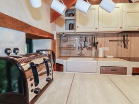 A kitchen with a toaster, kettle, and sink at Stribleys Barn in Cusgarne near St Day