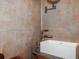 A bathroom with a sink and faucet at Stribleys Barn Cusgarne near St Day