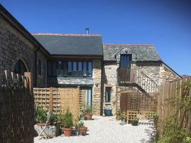 A building with windows and stairs in an outdoor area at Pit Paddy Barn Cusgarne near St Day