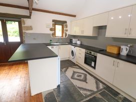 A kitchen with appliances and a countertop at The Shippen in Rosudgeon