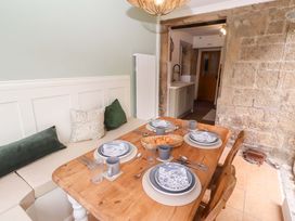 A dining room with a table set for meals at The Lodge in Powburn