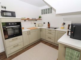 A kitchen equipped with modern appliances and utensils at The Lodge in Powburn