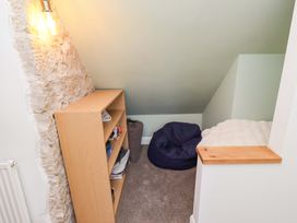 An attic space with a shelf and bean bag at The Lodge in Powburn