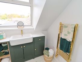 A bathroom with a sink and towel rack at The Lodge in Powburn