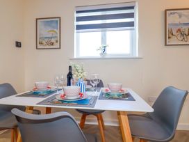 A dining room setup with table and chairs at 1 Vetch Avenue St Austell