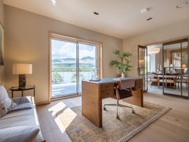 An office with a desk and lamp at Deer Close in Coniston