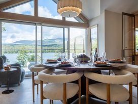 A dining room with a table set for meal at Deer Close in Coniston