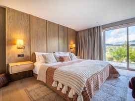 A bedroom with a bed and nightstand at Deer Close in Coniston