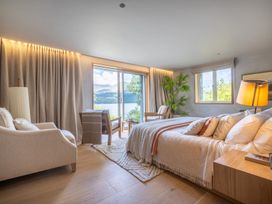 A bedroom with a bed and a window at Deer Close in Coniston