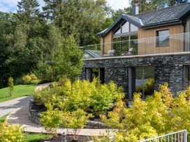A house with a balcony in a garden at Deer Close in Coniston