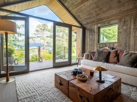 A living room with a sofa and coffee table at Deer Close in Coniston