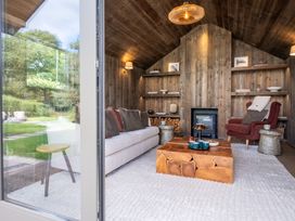 A living room with a sofa and a coffee table at Deer Close in Coniston