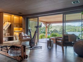 An indoor exercise area with fitness equipment and a view at Deer Close in Coniston