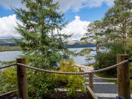 A view of trees and a lake at Deer Close in Coniston