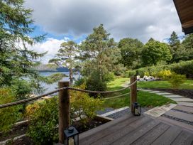 An outdoor area with a deck and views of nature at Deer Close in Coniston