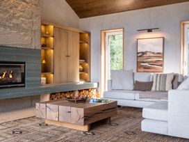 A living room with a sofa and coffee table at Deer Close in Coniston