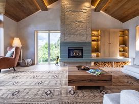A living room with a fireplace and a coffee table at Deer Close in Coniston