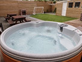 A hot tub in a garden with a goalpost at 51 Trinity Avenue Llandudno