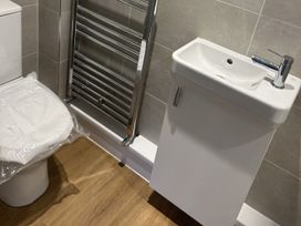 A bathroom with a toilet and a sink at 40 Gloddaeth View in Llandudno
