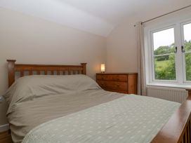 A bedroom with a bed and chest of drawers at 2 Loxter Villas Wellington Heath near Ledbury