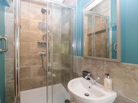 A bathroom with a shower and sink at 2 Loxter Villas Wellington Heath near Ledbury