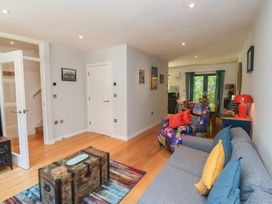 A living room with a sofa and coffee table at 8 Pottery Cottages