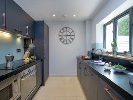 A kitchen with a countertop and appliances at Mariners Retreat, 8 Pottery Cottages, Dartmouth
