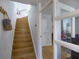 A staircase located in the hallway at Mariners Retreat, 8 Pottery Cottages in Dartmouth