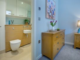 A bathroom with a toilet and sink at Mariners Retreat, 8 Pottery Cottages Dartmoor