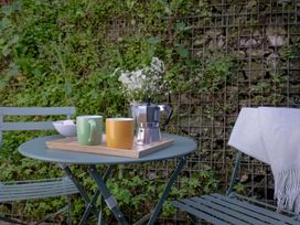 A table with coffee maker and cups at Mariners Retreat, 8 Pottery Cottages, Dartmouth