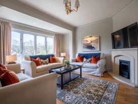A living room with sofas and a coffee table at Marina View in Bowness-On-Windermere
