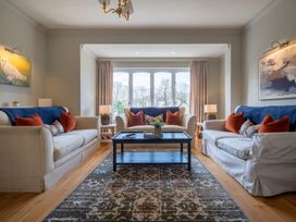 A living room with sofas and a coffee table at Marina View in Bowness-On-Windermere