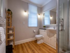 A bathroom with a sink and shower at Marina View in Bowness-On-Windermere