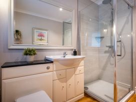 A bathroom with a sink and shower at Marina View in Bowness-On-Windermere