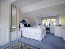 A bedroom with a bed and desk at Marina View in Bowness-On-Windermere