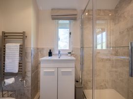 A bathroom with a shower and sink at Marina View in Bowness-On-Windermere