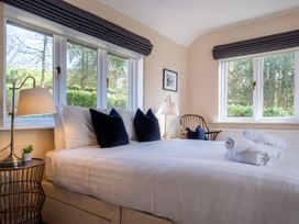 A bedroom with a bed and lamp at Marina View in Bowness-On-Windermere