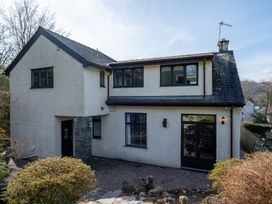 A house with multiple windows and a pathway at Marina View in Bowness-On-Windermere