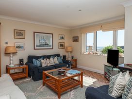 A living room with a sofa and coffee table at 6 Burgh Island in Bigbury-On-Sea